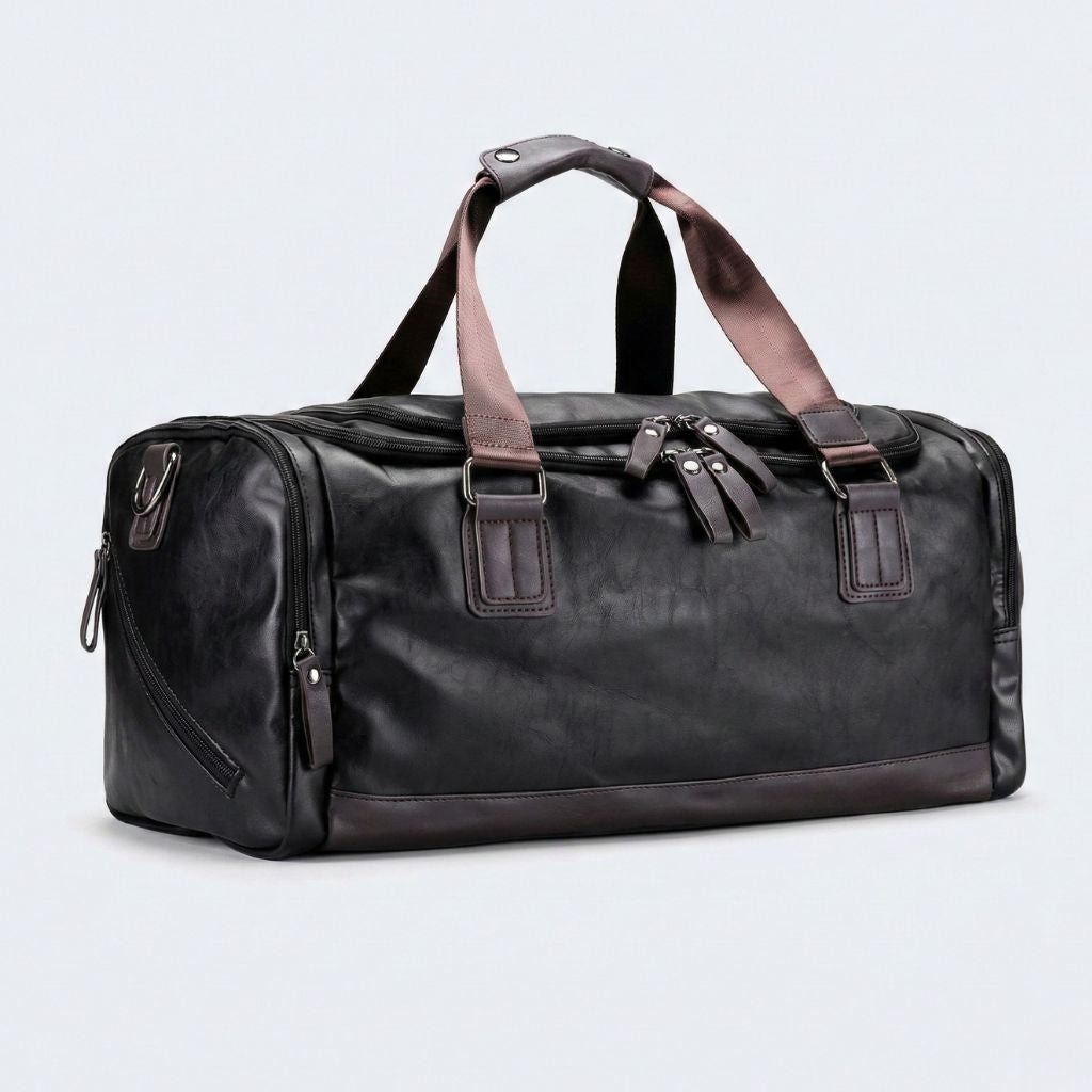 Duffle Bag cabine noir en simili cuir grainé, bandoulière et poignées marron, fermetures éclairs noires