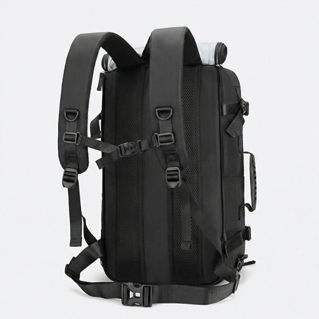 Dos du sac de voyage noir avec bretelles maillées rembourrées larges, sangles de compression et ceinture ventrale