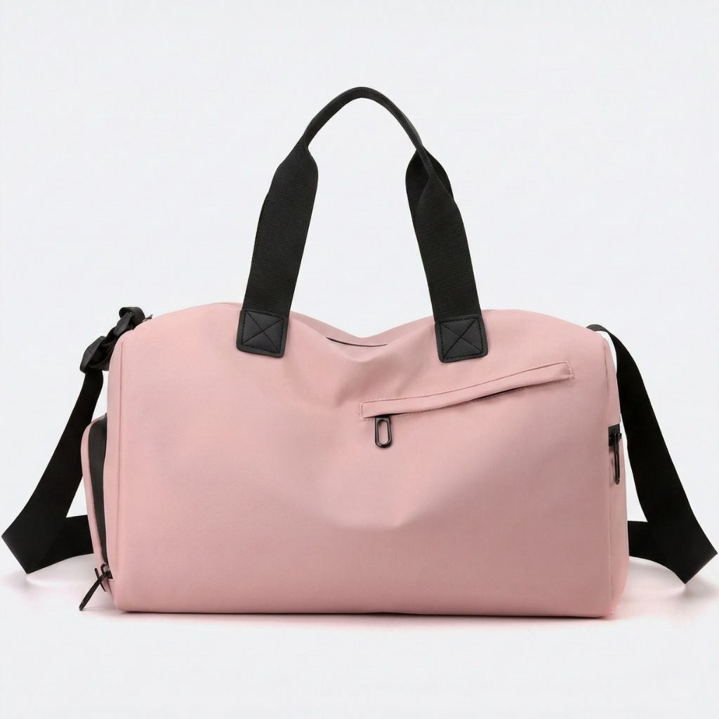 Petit sac de voyage imperméable rose avec doubles poignées noires et poche frontale zippée