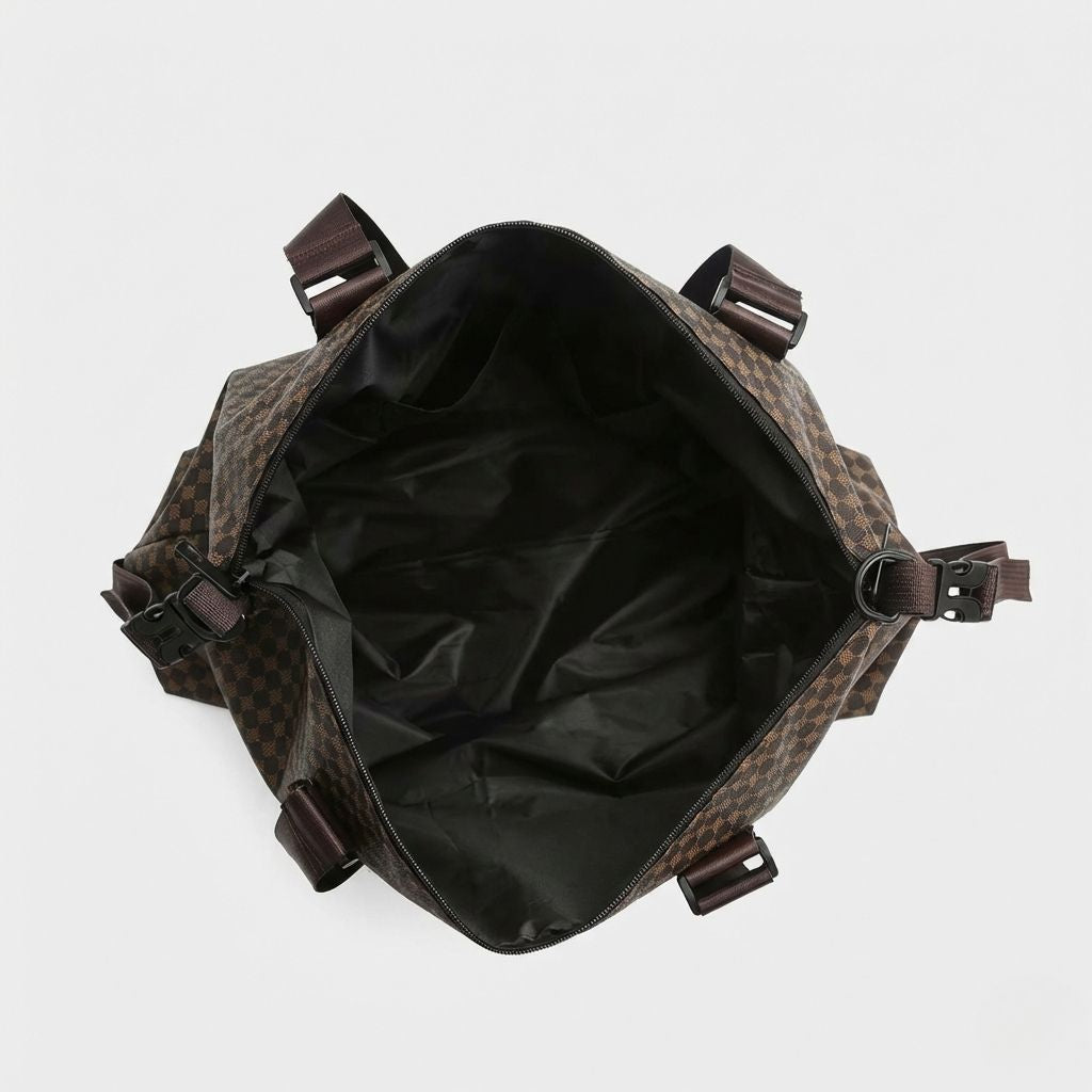 Vue de dessus du sac cabine damier marron ouvert, vaste intérieur à doublure noire, double zip