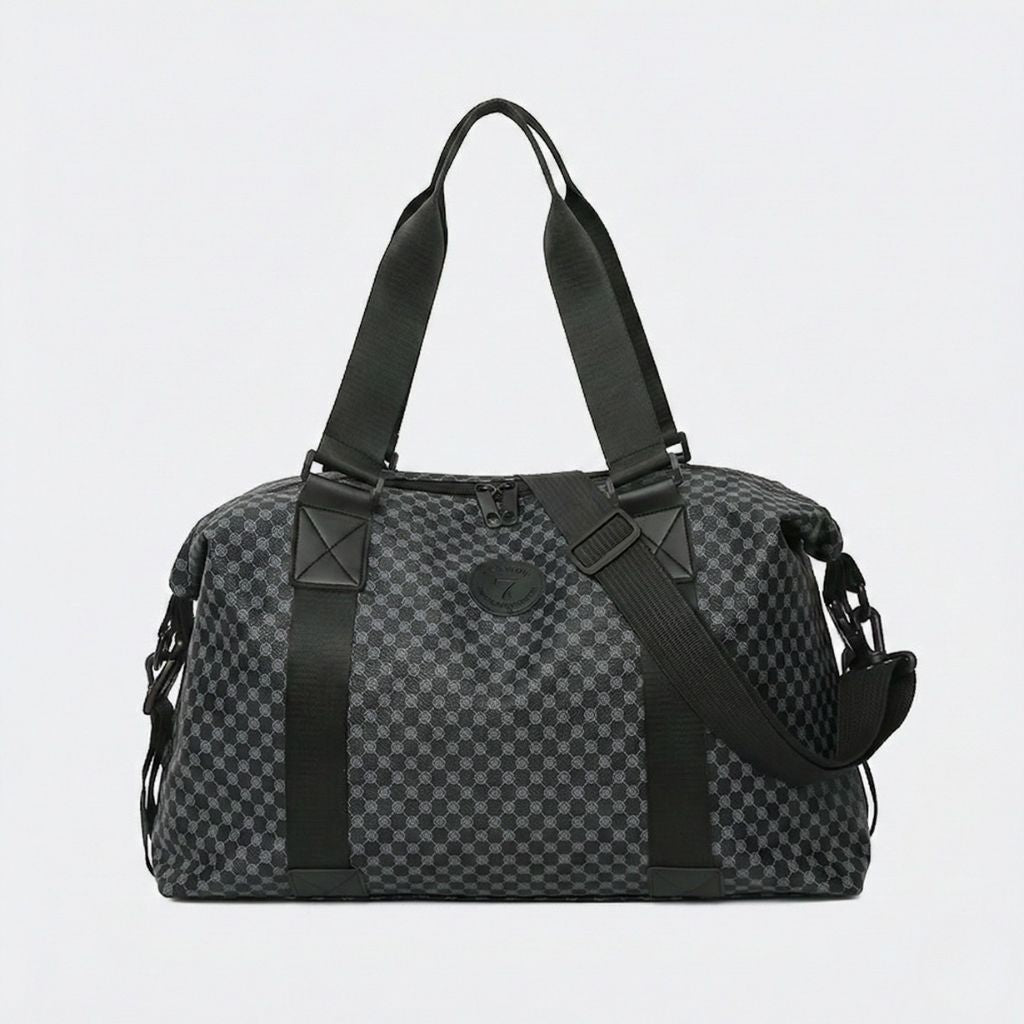 Sac de voyage cabine motif damier noir et gris anthracite, vue de face avec badge central et sangles