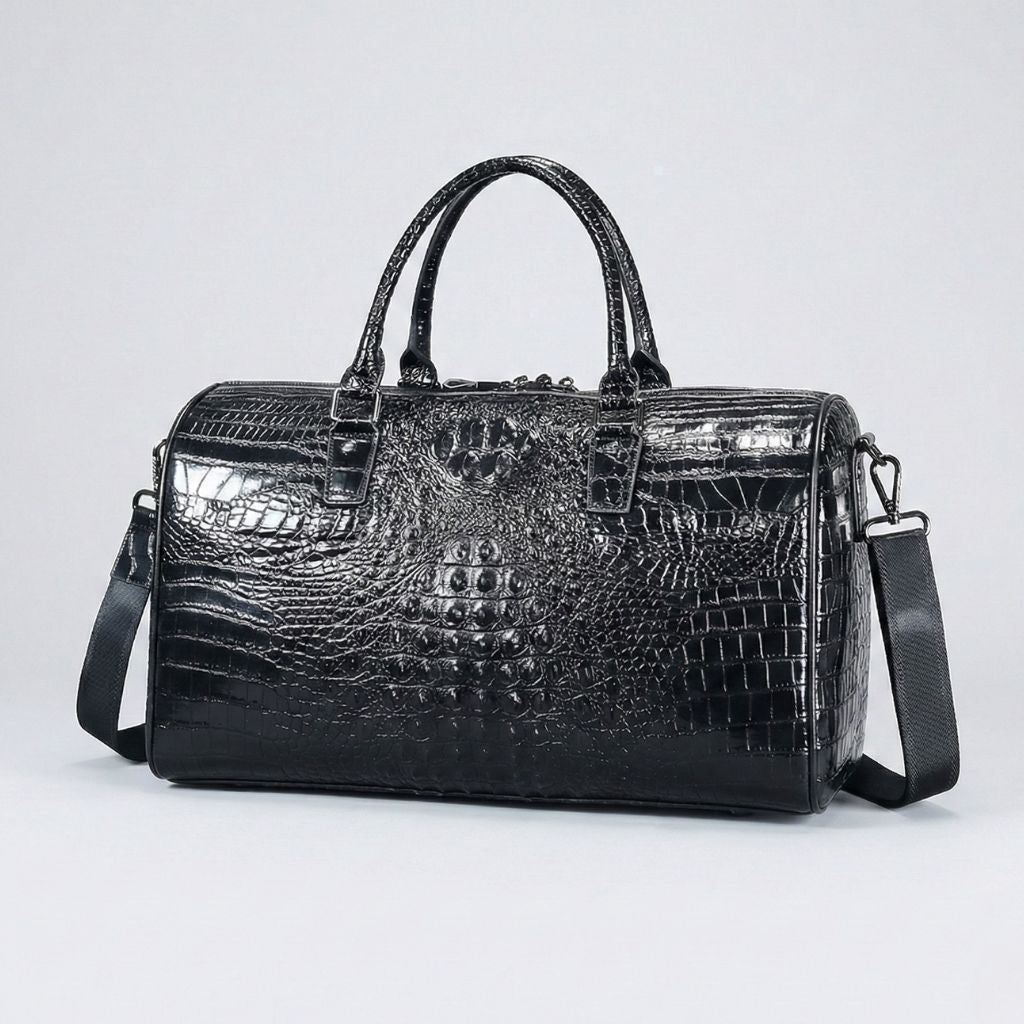 Sac de voyage en cuir embossé crocodile noir brillant format cabine, bandoulière réglable et pieds métal