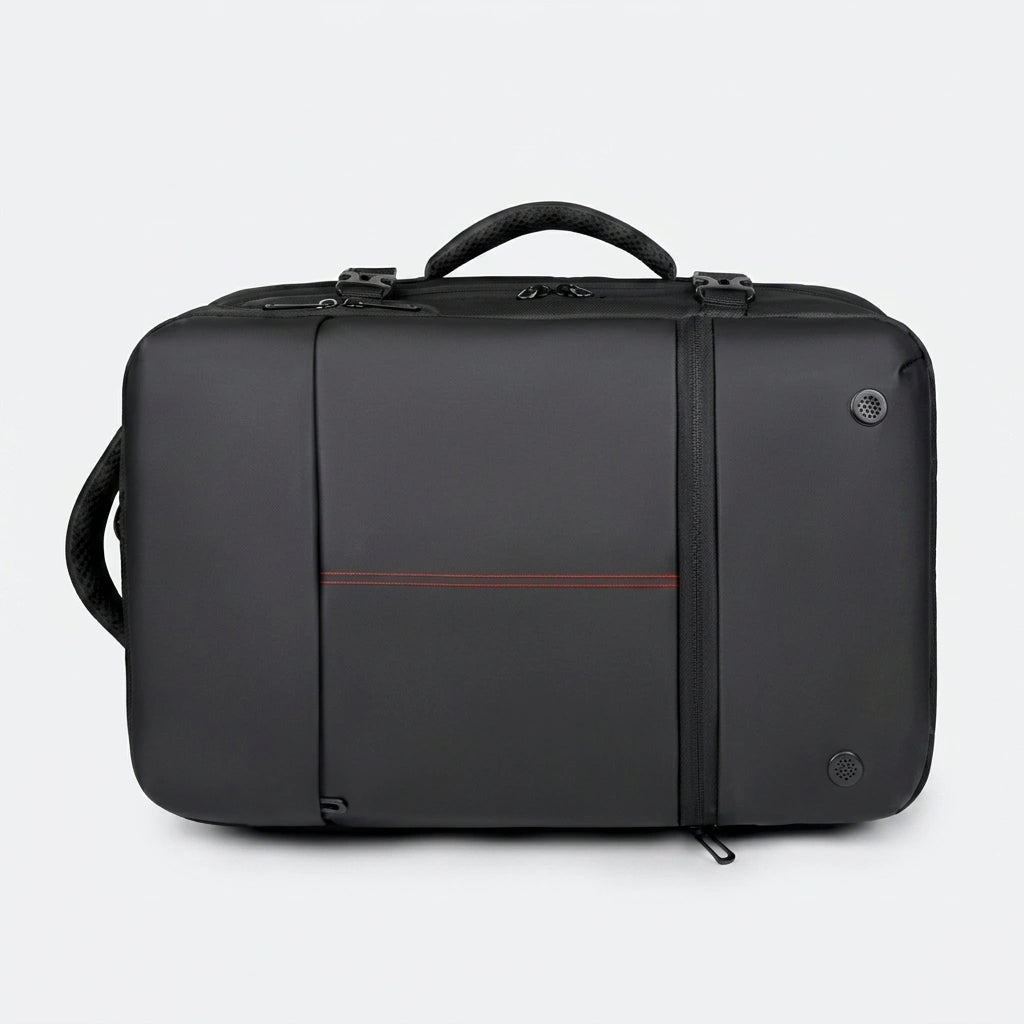 Sac à dos business noir en mode mallette posé à plat avec poignée supérieure et oeillets de ventilation