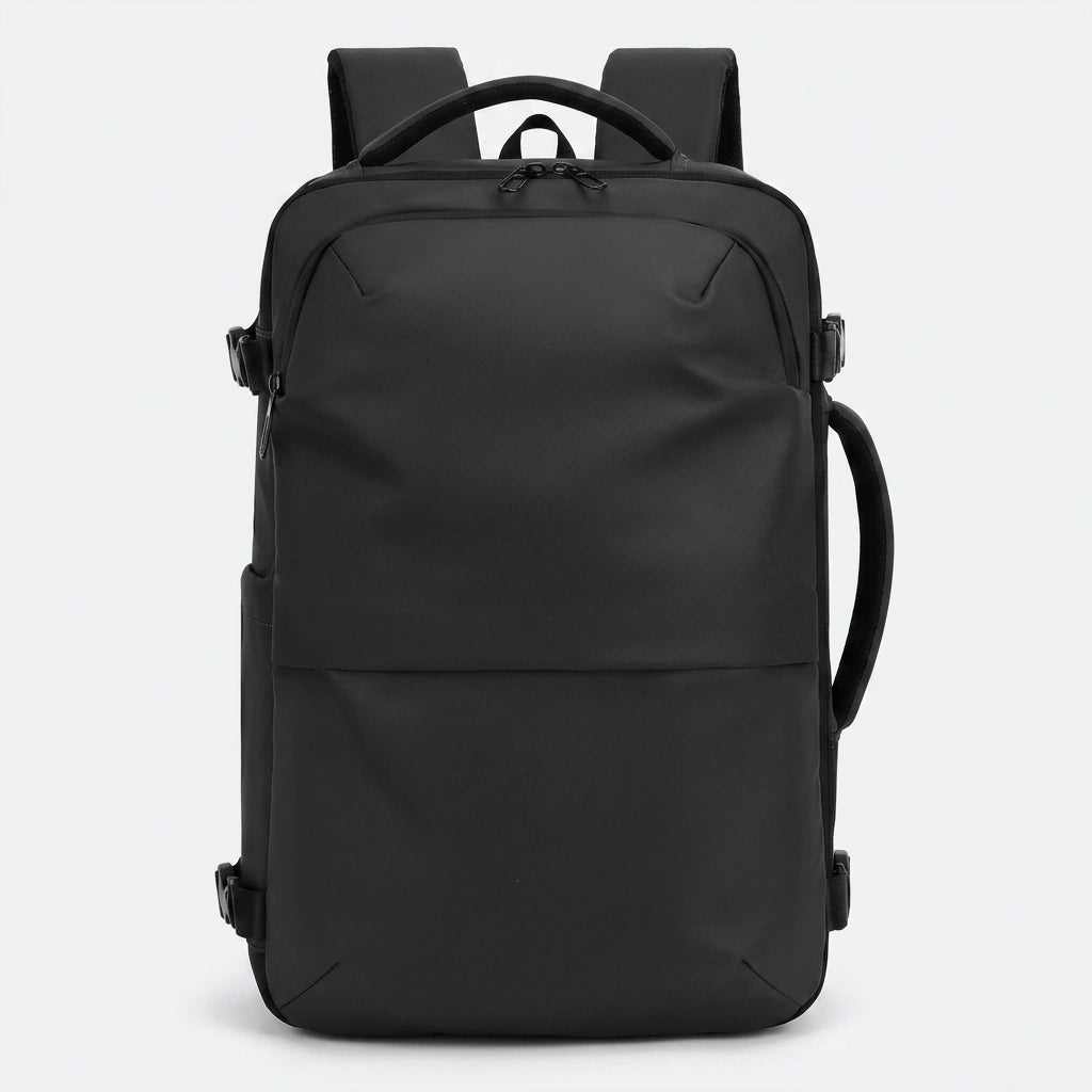 Sac à dos de voyage noir vue de face avec design minimaliste et poignée de transport supérieure