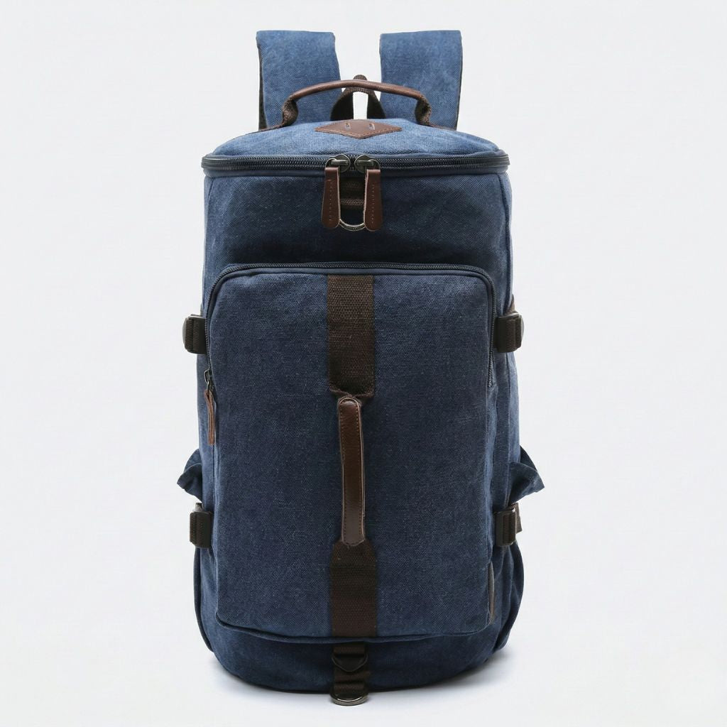 Sac à dos duffle bleu marine en toile lavée, vue frontale, grandes poches zippées et bretelles réglables noires