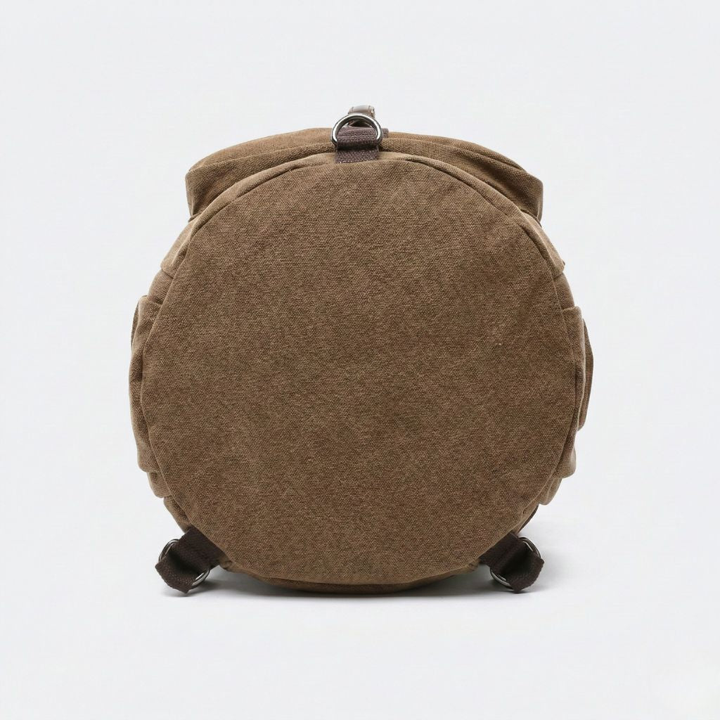 Fond circulaire du sac de voyage duffle brun camel en toile épaisse avec passants en toile marron visibles