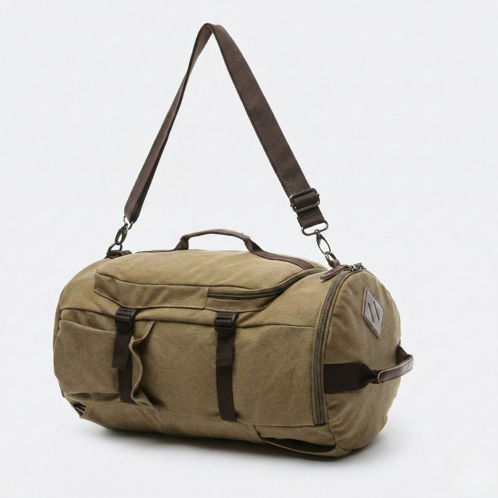 Sac de voyage duffle kaki en mode polochon avec bandoulière réglable, poches latérales et sangles marron