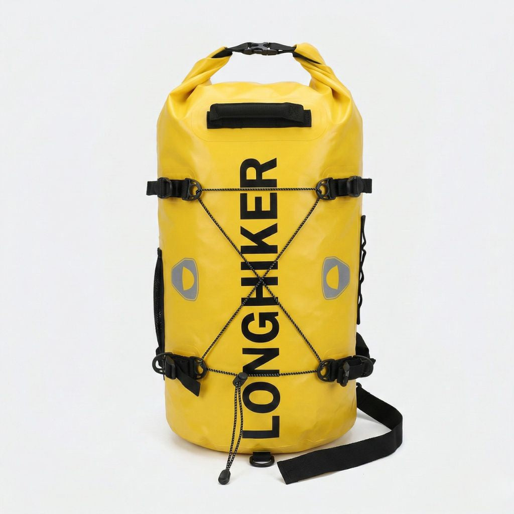 Sac étanche jaune roll-top de face avec cordages croisés sur la face avant et pastilles réfléchissantes