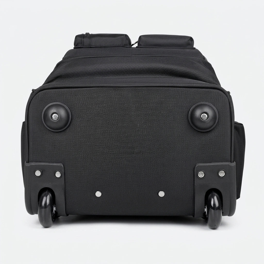 Vue du dessous du sac à dos trolley noir 35L, deux roulettes caoutchouc noires et semelles renforcées