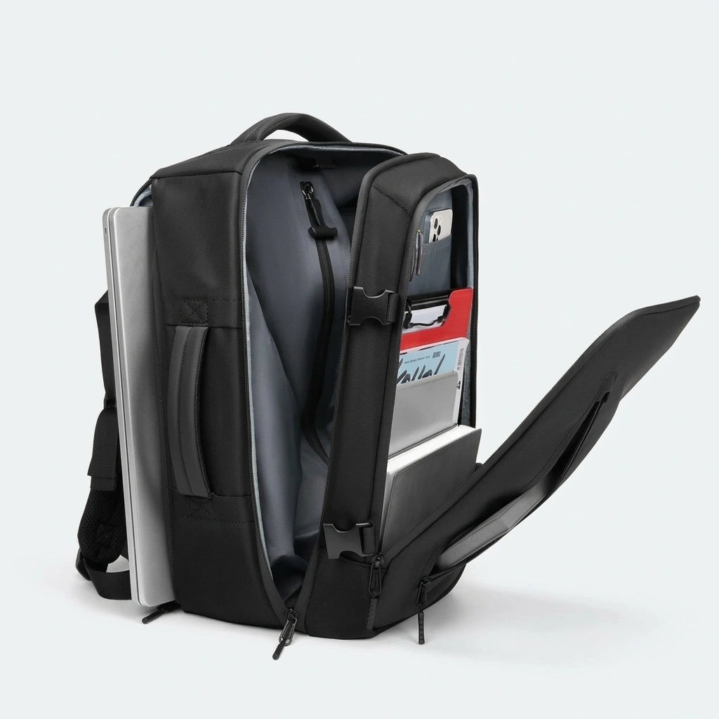 Sac a dos business noir ouvert lateralement revelant compartiment laptop tablette et poche organiseur documents