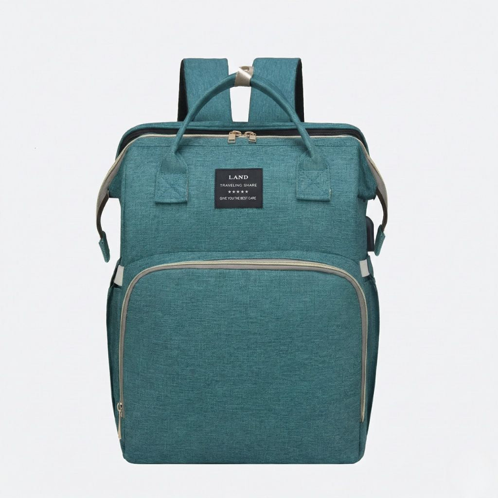 Sac à langer vert canard face avant : poignées de portage courtes, deux zips principaux et compartiments