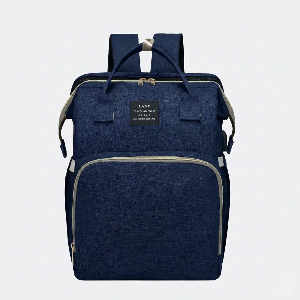 Sac à langer bleu marine face avant : poignées courtes, deux fermetures zippées et large compartiment principal
