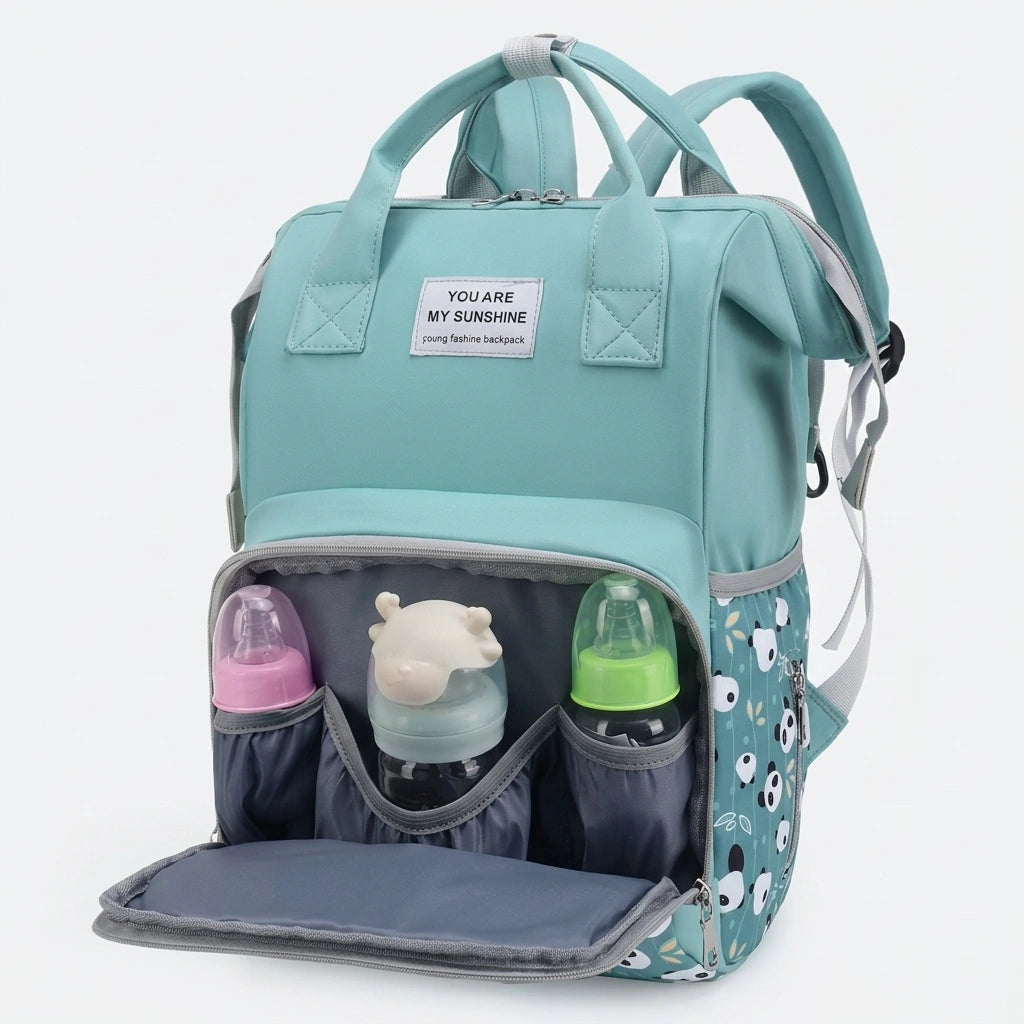 Poche frontale isotherme ouverte du sac à dos à langer avec trois biberons rangés, coloris vert menthe Image