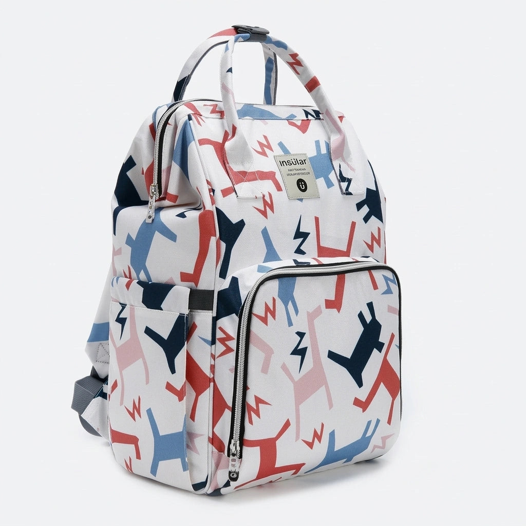 Sac à dos à langer blanc motif chiens colorés géométriques rouge et bleu marine, vue trois-quarts