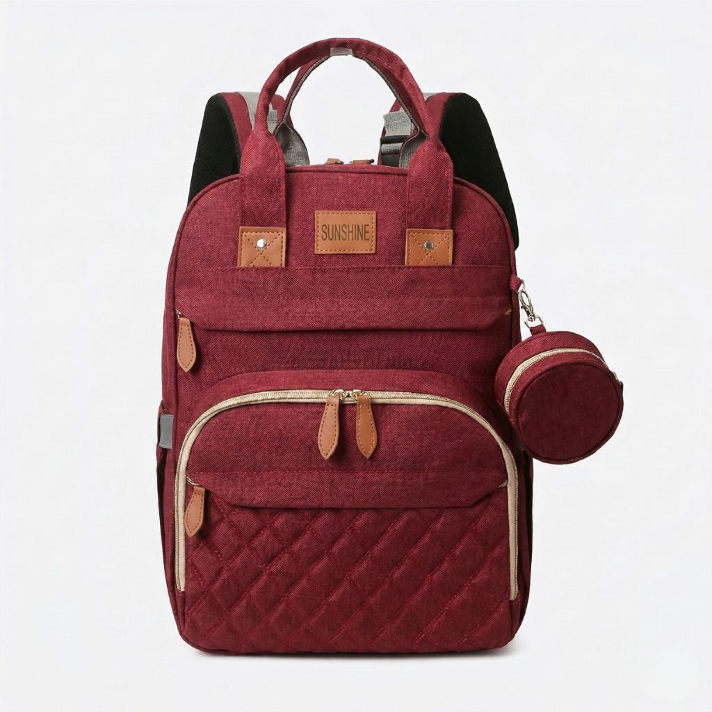 Sac à langer bordeaux chiné face avant avec doubles poignées, pochette ronde zippée et poche matelassée