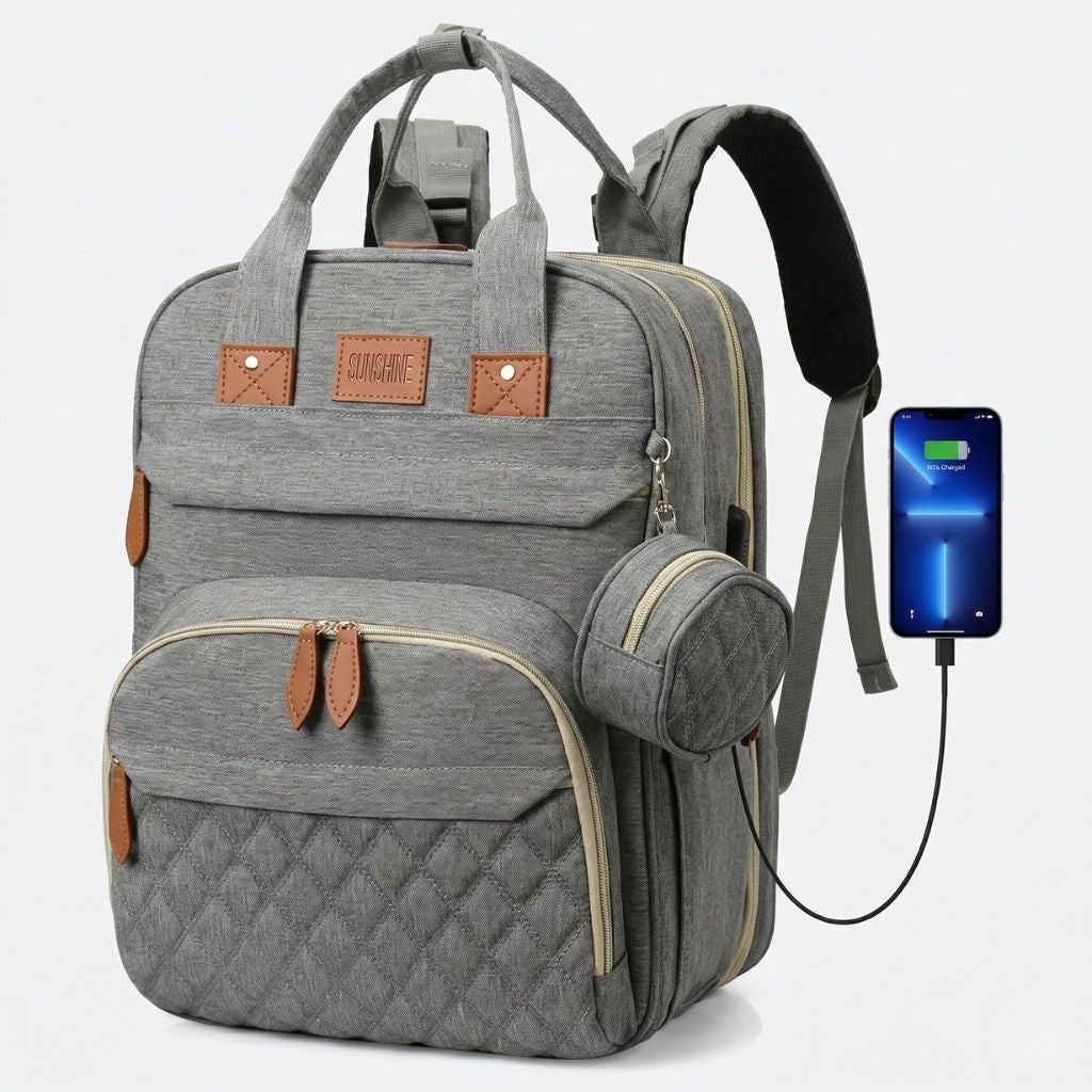 Sac à langer gris chiné face avant avec port USB extérieur actif, smartphone en charge et pochette ronde
