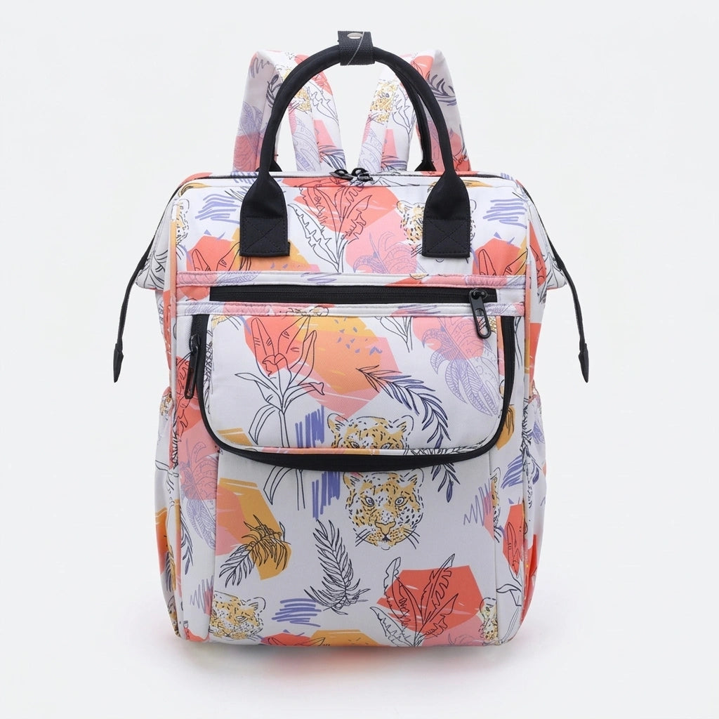 Sac à dos à langer multicolore pastel motif léopards et fleurs tropicales, vue de face, anses noires