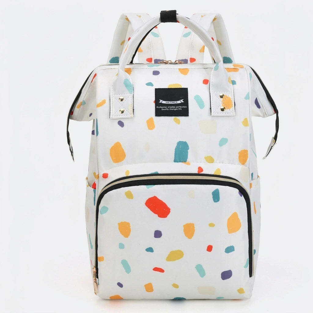 Sac à dos à langer blanc motif taches de peinture multicolores, vue de face, anses et compartiment