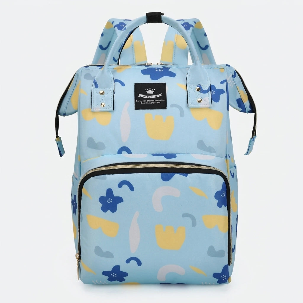 Sac à dos à langer bleu ciel motif fleurs géométriques, vue de face, grandes anses et fermeture éclair