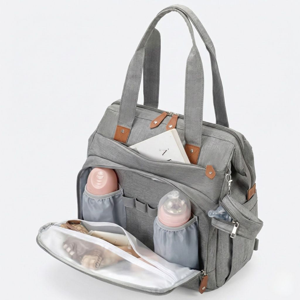 Intérieur du sac gris chiné ouvert : porte-biberons élastiques et compartiment isotherme doublure argentée