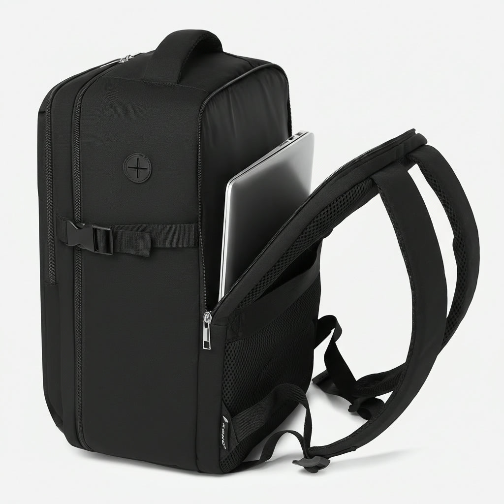 Vue de côté d'un sac à dos cabine noir avec le compartiment PC latéral ouvert révélant un ordinateur portable Image
