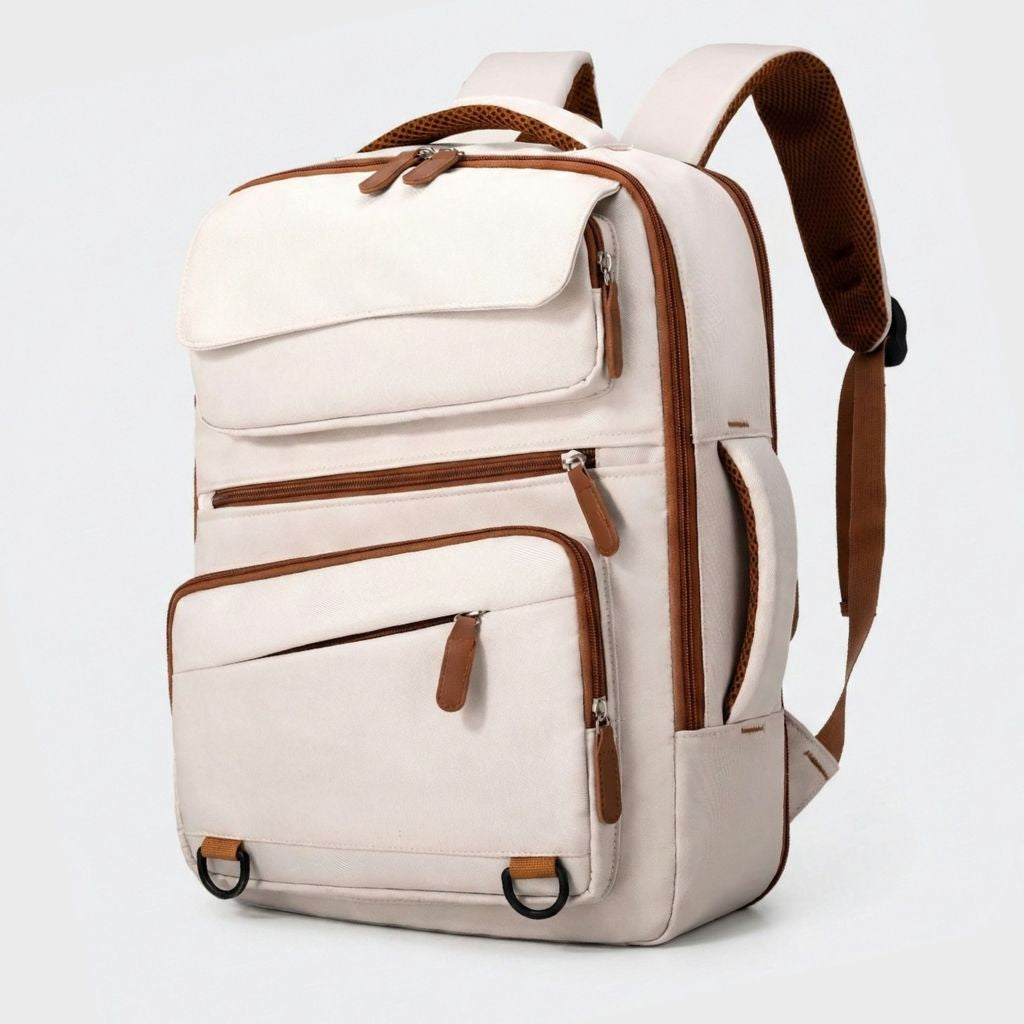 Sac à dos de voyage beige ivoire avec accents et tirettes caramel, bretelles maillées, multi-compartiments