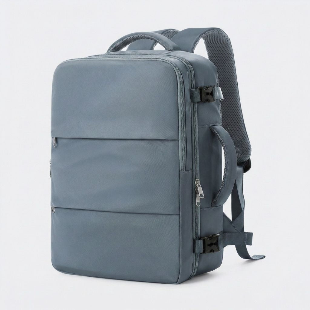Sac à dos cabine gris ardoise vu de trois quarts avec poches horizontales zippées et sangles noires
