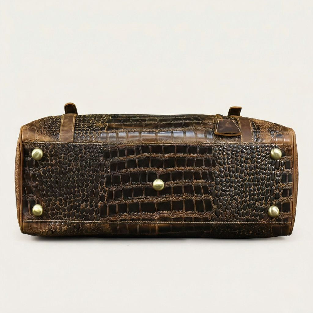 Semelle du sac de voyage cabine en cuir croco brun, quatre pieds protecteurs en laiton vieilli antirayures