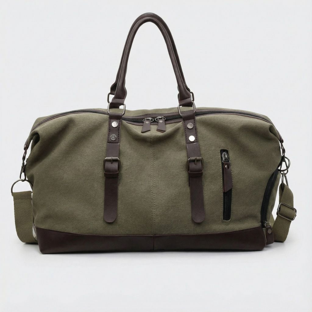 Sac de voyage en toile kaki avec poignées en cuir marron, bandoulière réglable et poche latérale zippée