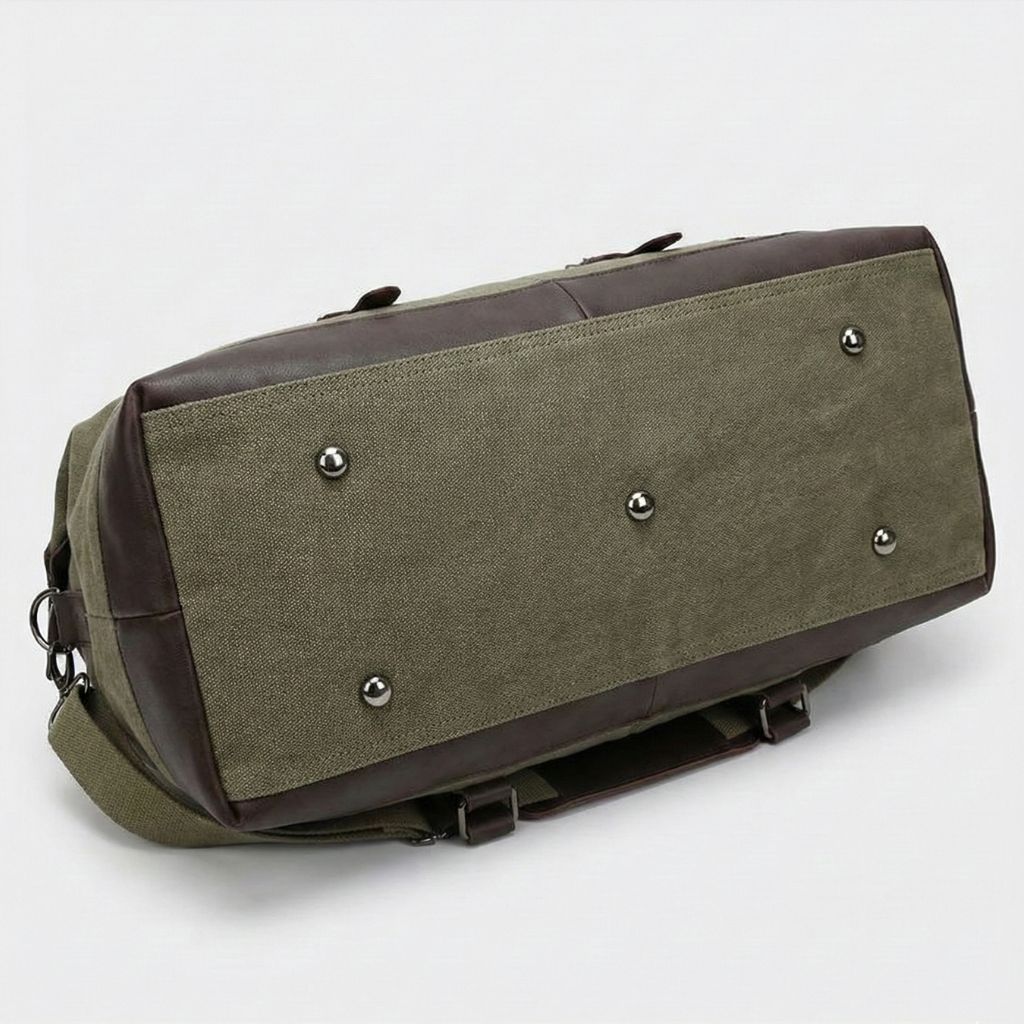 Sac de voyage en toile kaki avec fond renforcé en cuir marron et pieds métalliques de protection Image