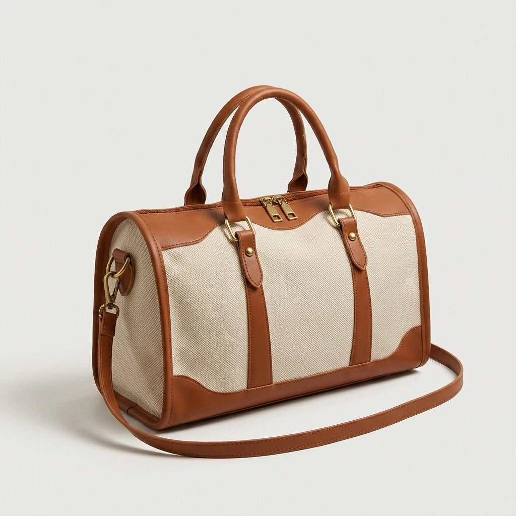Sac de voyage vintage grande taille en toile beige et cuir cognac, vue de côté avec fermeture dorée