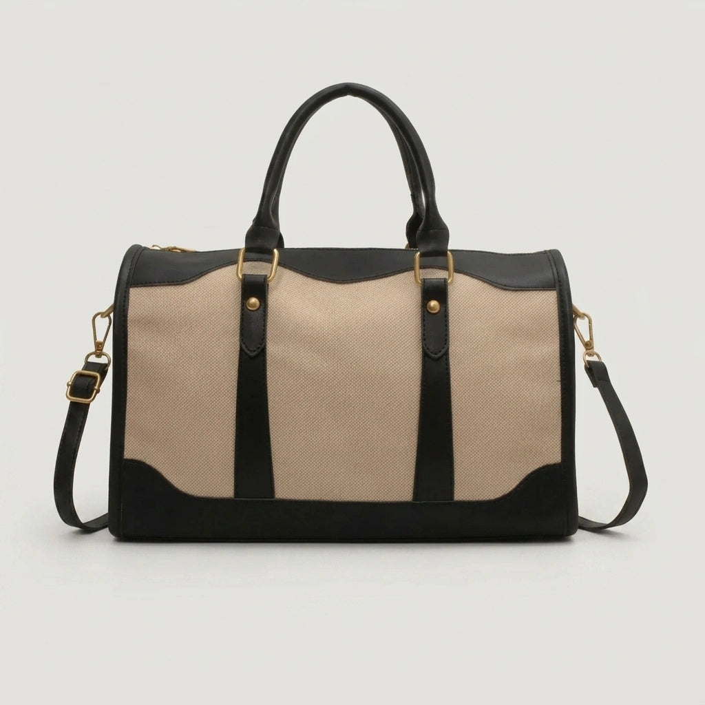 Sac de voyage vintage petit format en toile beige et cuir noir, vue de face avec hardware doré et rivets