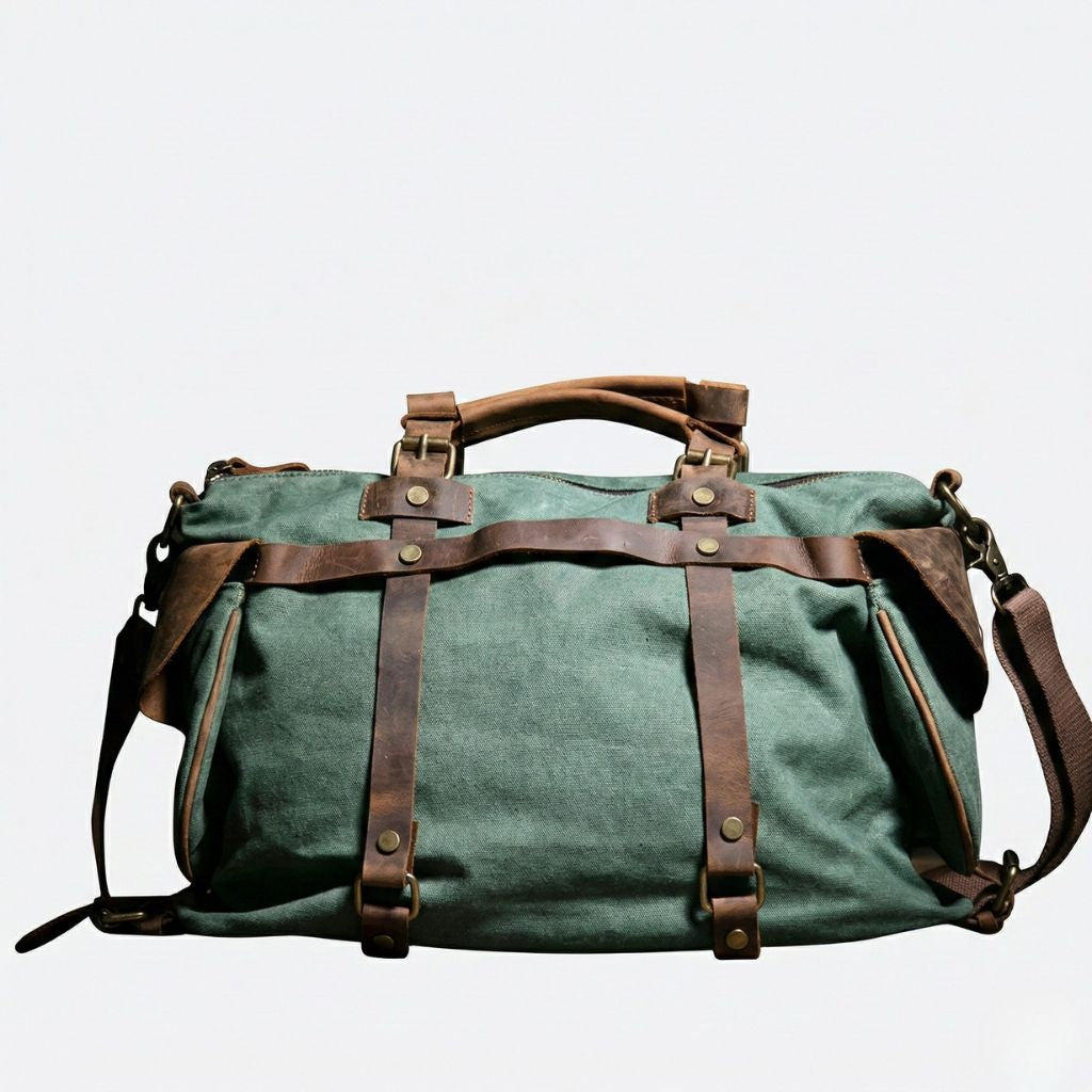 Sac de voyage vert forêt face avant : canvas militaire, sangles cuir marron croisées et bandoulière réglable