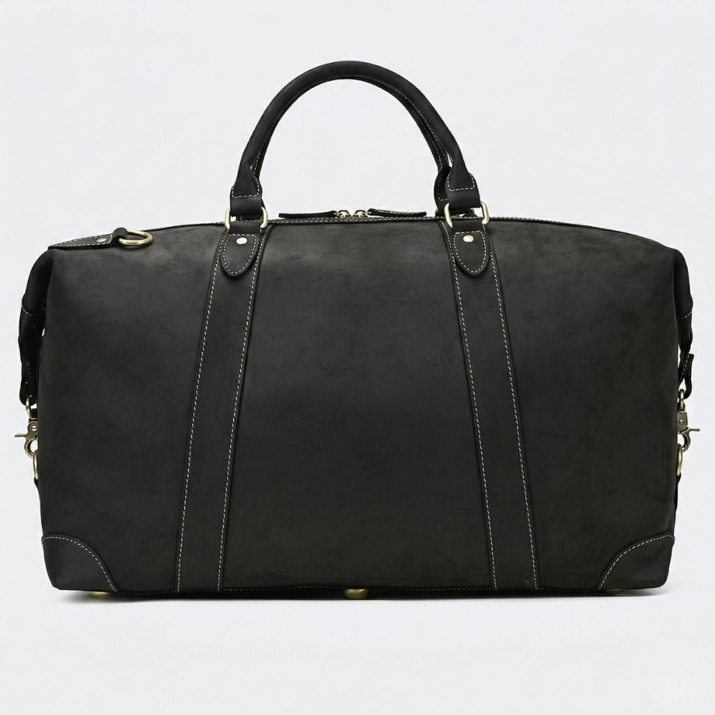 Verso du grand sac de voyage en cuir noir mat, trois nervures verticales cousues et anneau en D laiton