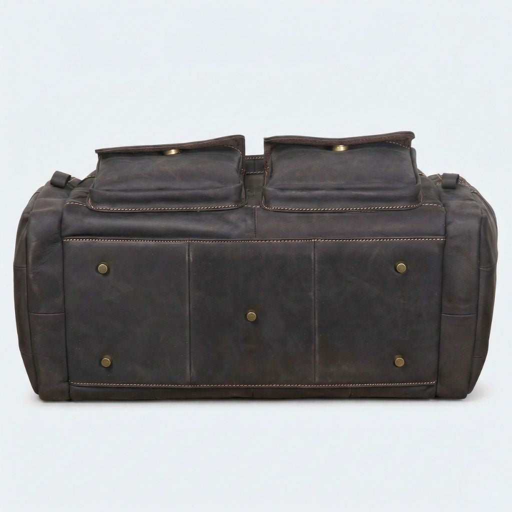 Semelle du sac de voyage cabine cuir Crazy Horse noir, cinq pieds protecteurs bronze, base structurée