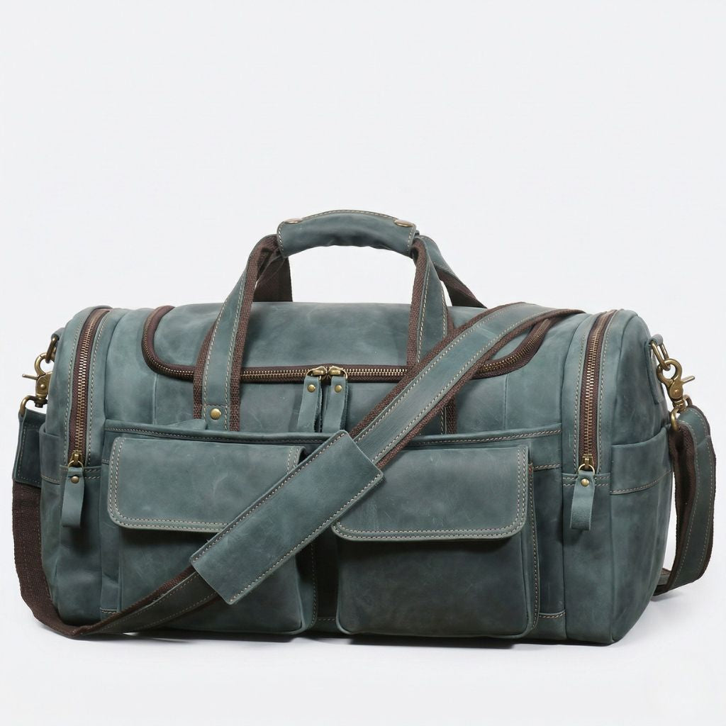 Sac de voyage cabine 23L en cuir Crazy Horse bleu-gris, vue de face, poches frontales et bandoulière marron