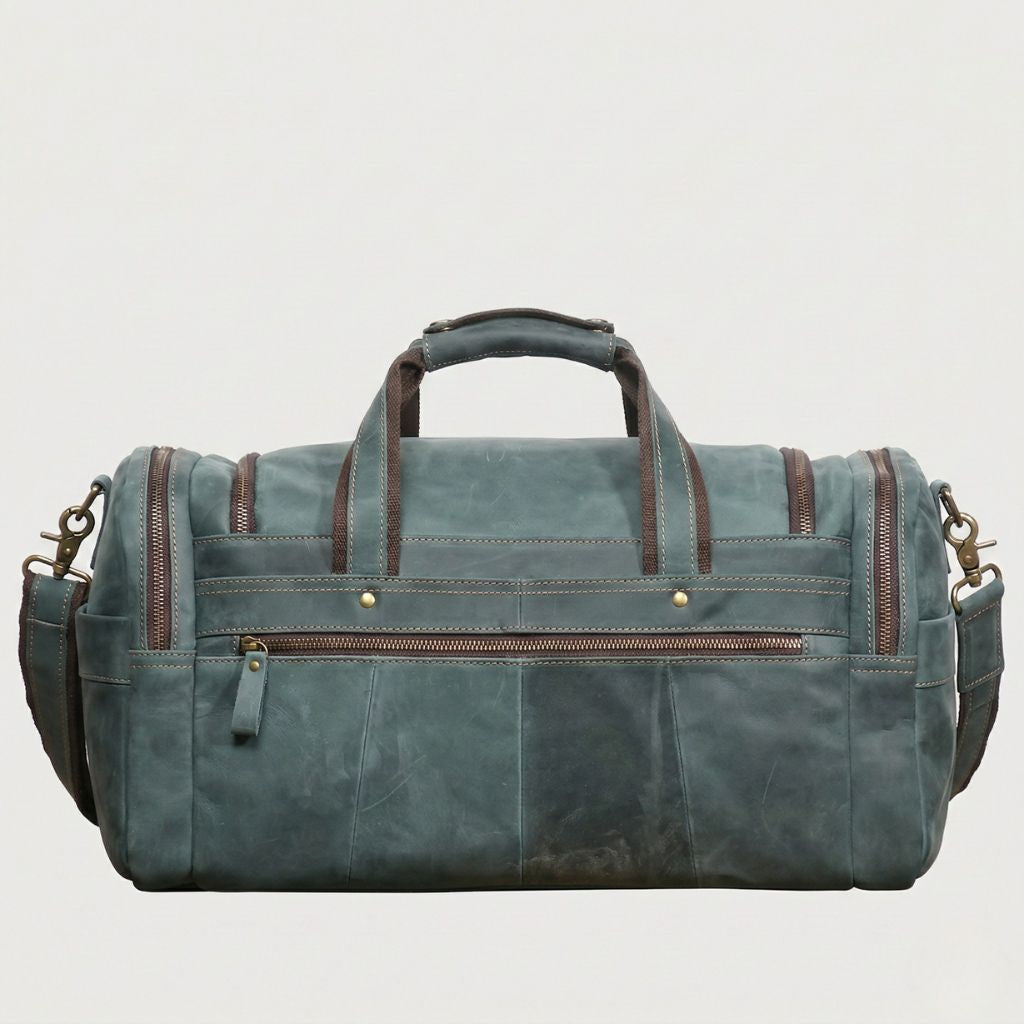 Face arrière du sac de voyage cabine cuir Crazy Horse bleu-gris, grande poche zippée et bandoulière visible