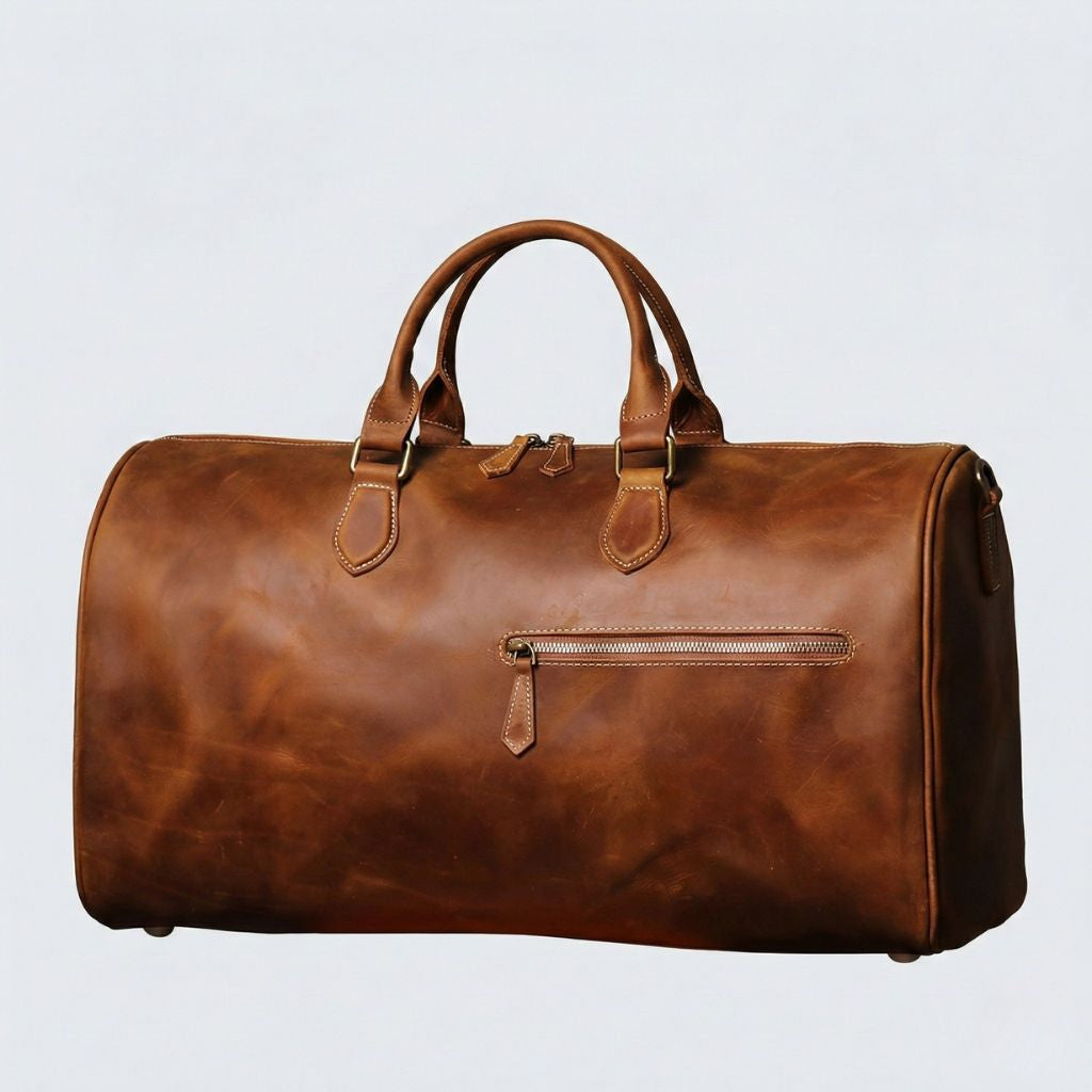 Sac de voyage cabine en cuir pleine fleur cognac, poche frontale zippée et bandoulière détachable