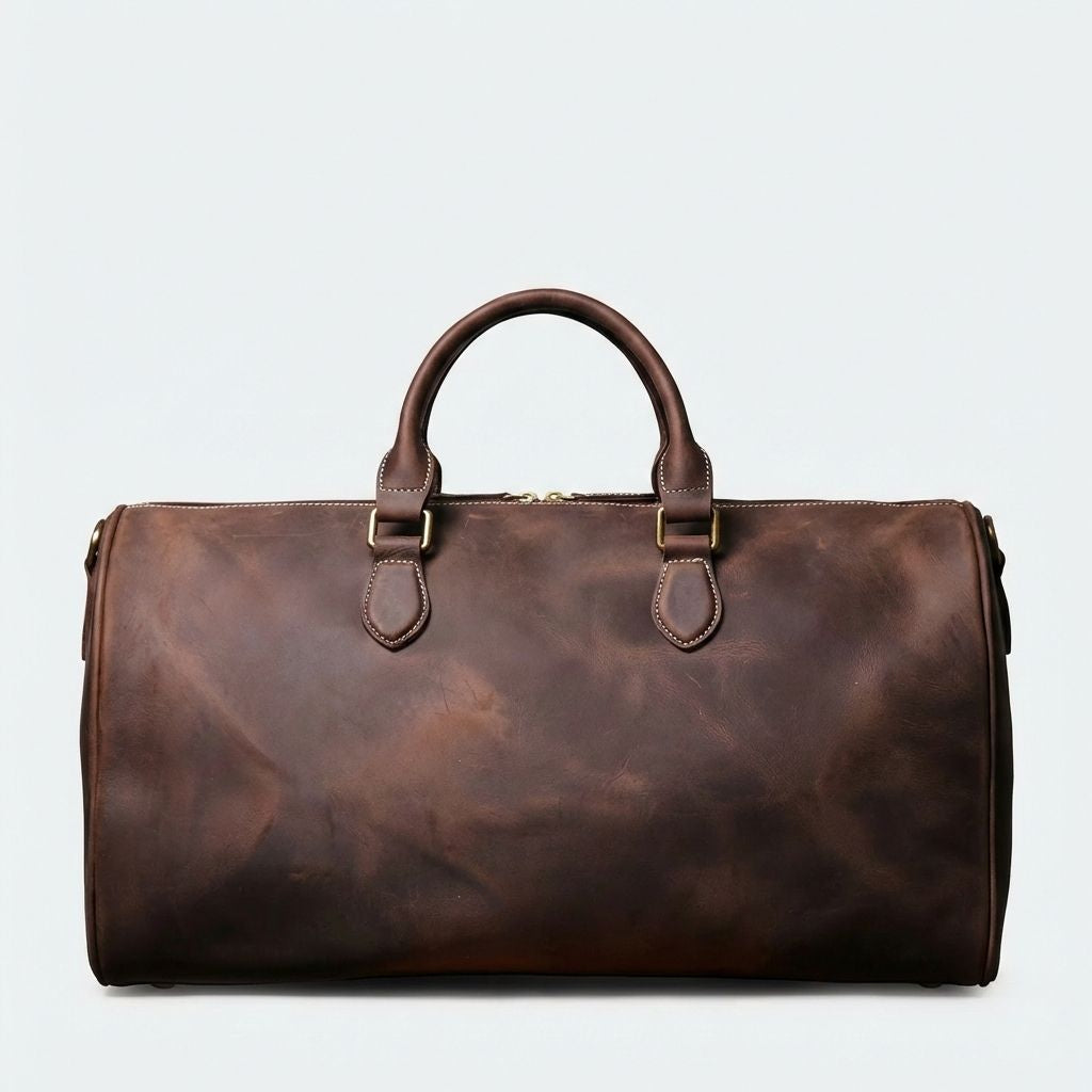 Dos du sac de voyage en cuir brun très foncé, profil lisse avec anneau D et surpiqûres contrastantes