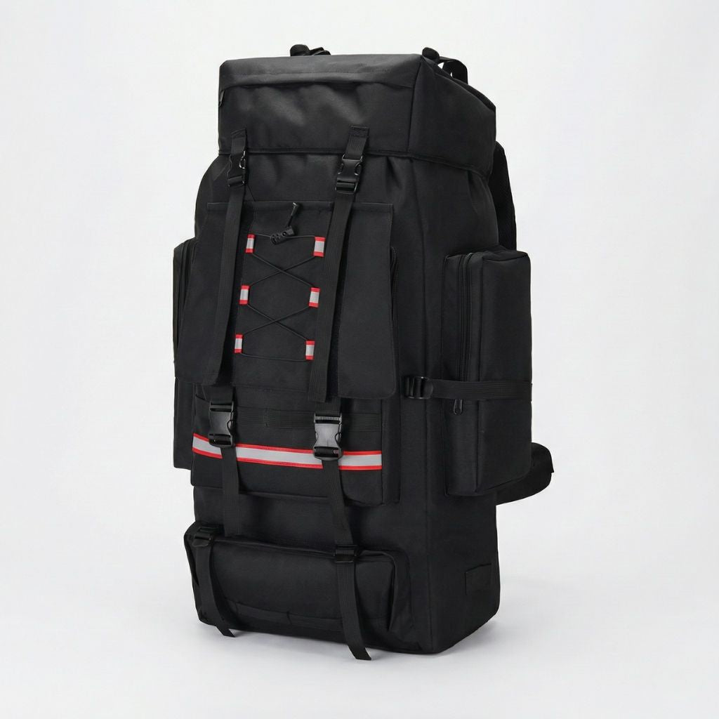 Sac à dos tactique noir 130L, vue 3/4, sangles croisées rouges, bandes réfléchissantes et poches latérales