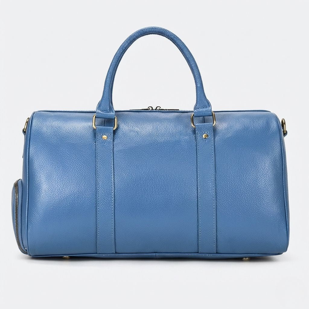 Dos du sac cabine bleu acier en cuir grainé avec double poignée et pieds protecteurs dorés