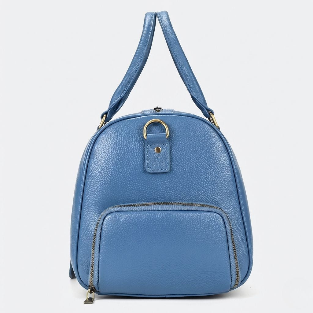 Côté du sac de voyage cabine cuir grainé bleu acier avec poche latérale zippée et anneau D