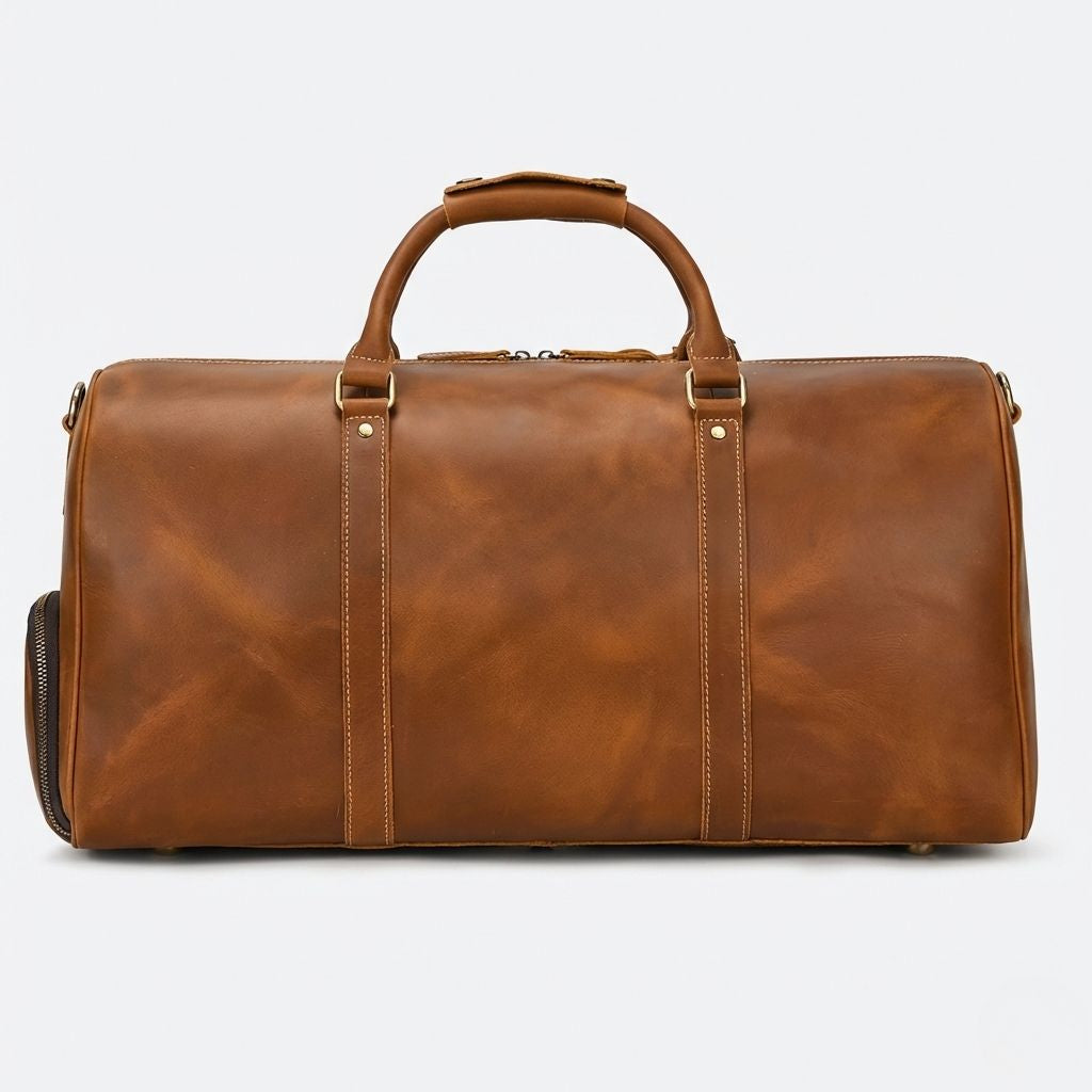 Dos du sac de voyage cuir crazy horse cognac, poignées courtes et double anneau fixe pour bandoulière