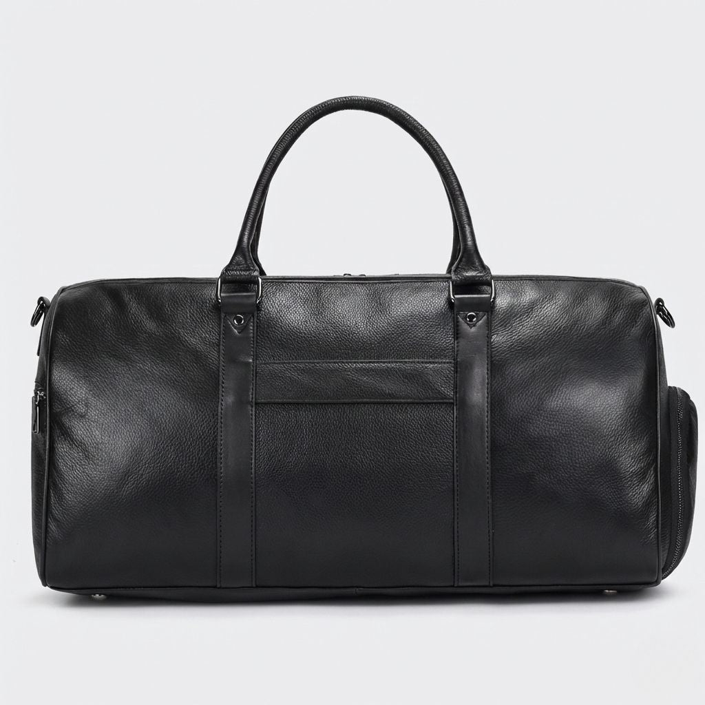 Sac de voyage cuir grainé noir, face avant avec doubles poignées rondes et bandoulière noire croisée