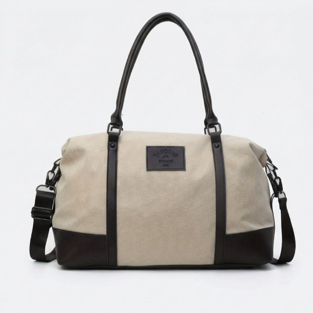 Sac de voyage en toile beige avec poignées noires et bandoulière réglable amovible