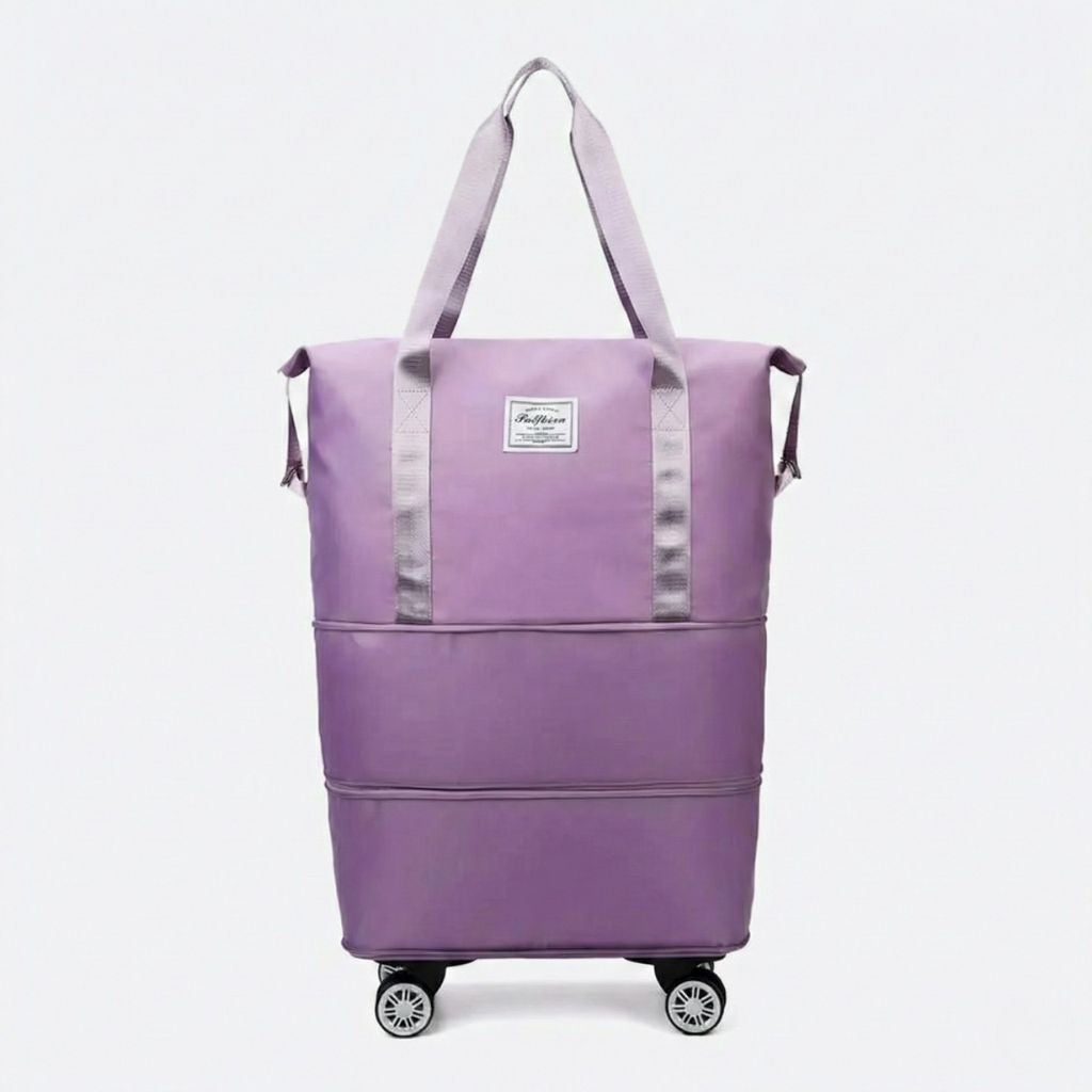 Sac de voyage femme extensible violet lilas sur quatre roulettes amovibles, vue de face, deux anses textiles