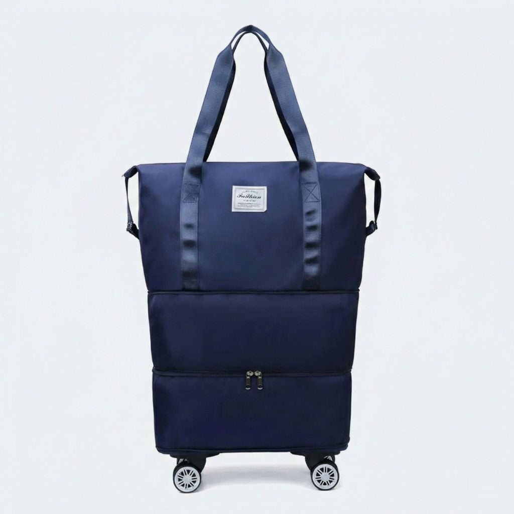 Sac de voyage femme extensible bleu marine sur quatre roulettes amovibles, deux anses et poche chaussures visible