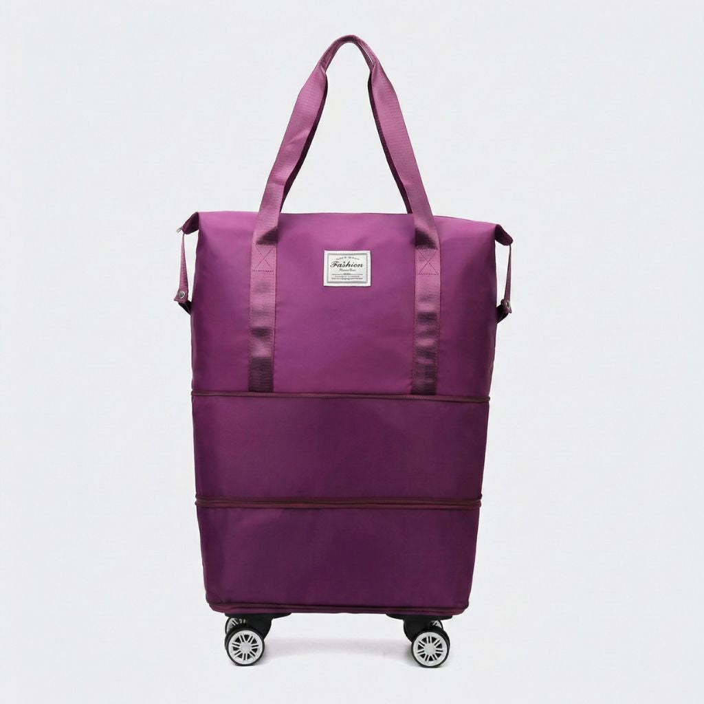 Sac de voyage femme extensible violet bordeaux sur quatre roulettes amovibles, vue de face, deux anses textiles