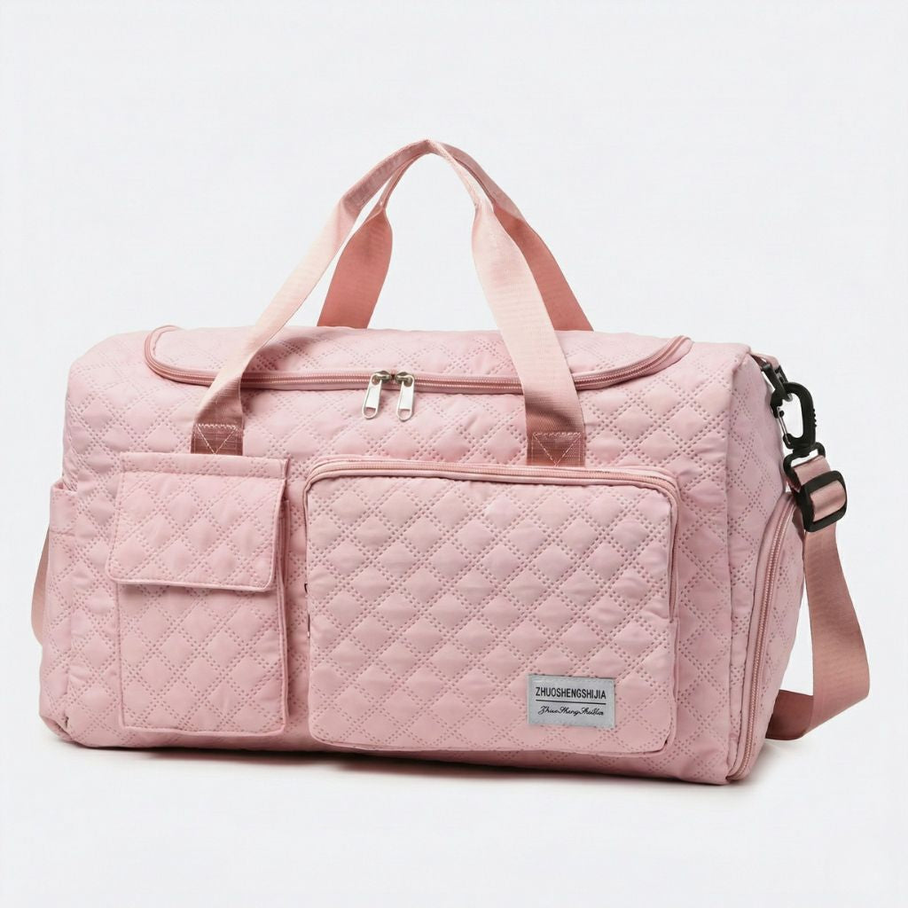 Sac de voyage femme cabine matelassé rose saumon, vue de face, double poignée et deux poches avant zippées