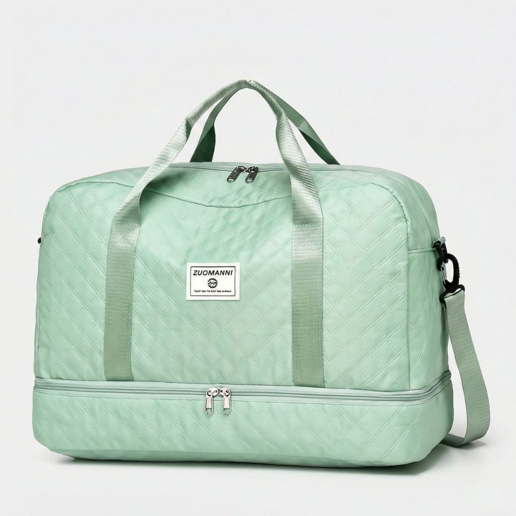 Sac week-end coloris vert menthe en vue 3/4, motif matelassé diamants et doubles poignées assorties